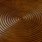 Close-up of a wooden surface with concentric circular patterns