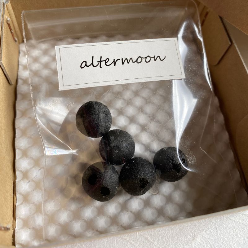 Nara Tea Co.'s altermoon brand 100% Natural Handcrafted kneaded Incense Kurobo, which is a bag of five black round incense sticks packaged in a square box.