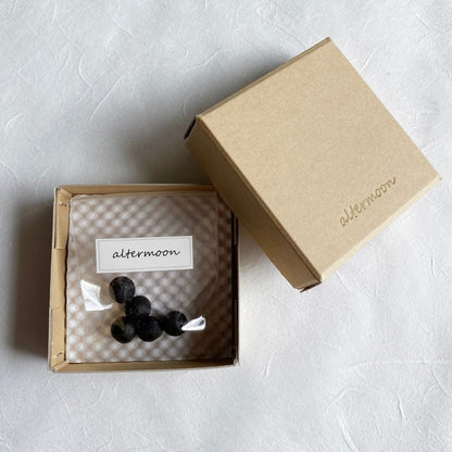 Nara Tea Co.'s altermoon brand 100% Natural Handcrafted kneaded Incense Kurobo, which is a bag of five black round incense sticks packaged in a square box.