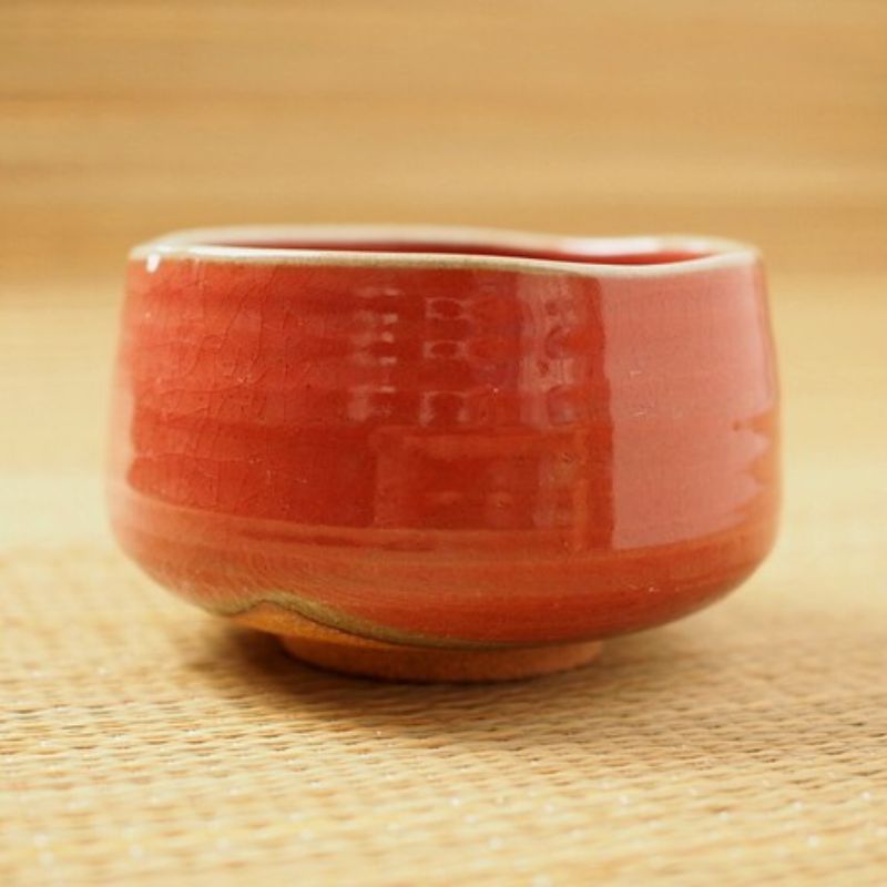 Akaraku Matcha Tea Bowl from Nara Tea Co. with a glossy texture and elegant fall color, seen from the front.