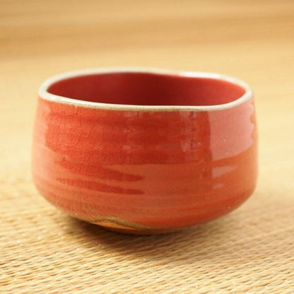 Akaraku Matcha Tea Bowl from Nara Tea Co. with a glossy texture and elegant autumn color, viewed from the front diagonally.