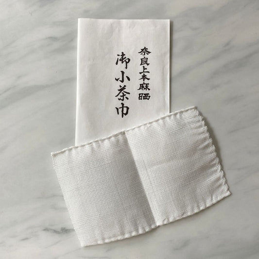 Nara Tea Co.'s 3 sets of Kochakin products, packaged in white paper sachets with the product name, and white cloth Kochakin