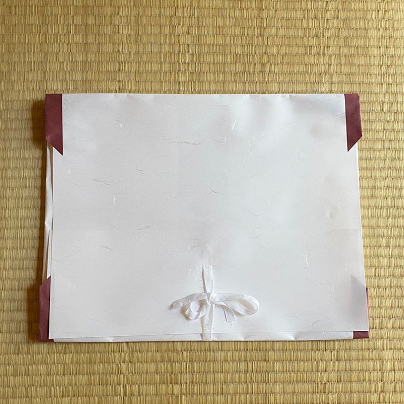 The packaging for Nara Tea Co.'s Tatoushi l kimono Storage Paper with Strings, a set of 10 sheets.