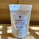 Clear package of Organic Barley Tea Bags with a label on a wooden surface