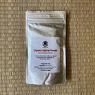 Package of Organic Hojicha Powder on a woven mat