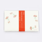 Pack of stationery with floral design on a white background