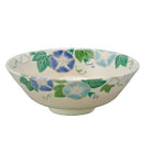 Ceramic bowl with floral design on a gray background