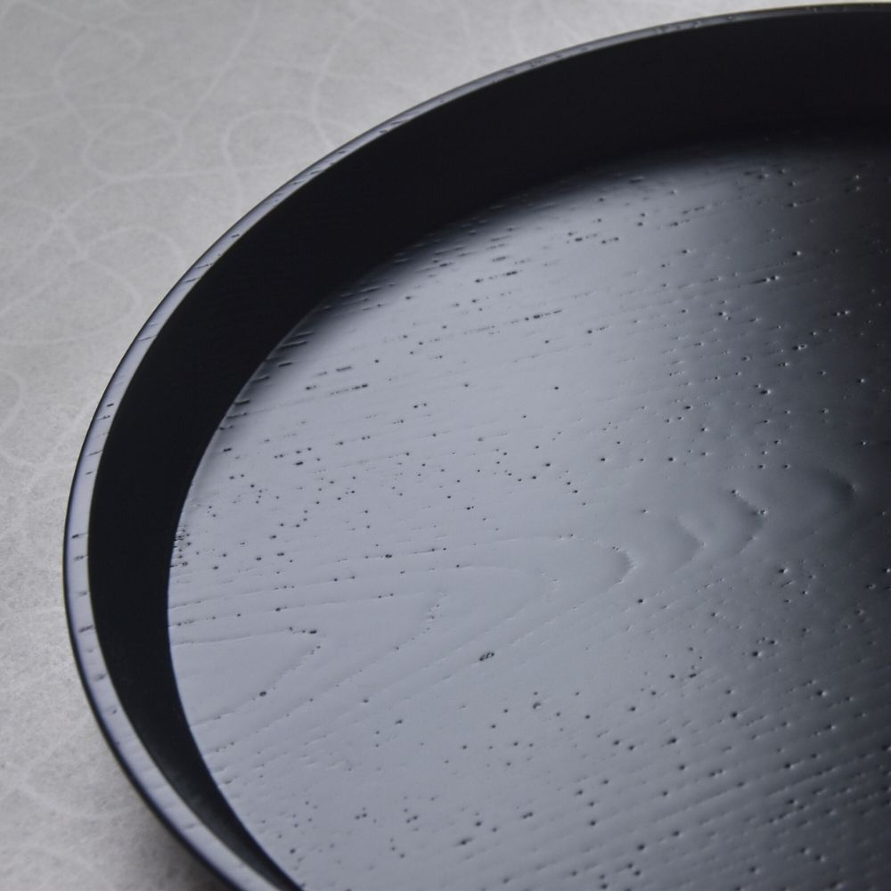 Black Lacquered Tray with textured surface on a light gray background