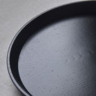 Black Lacquered Tray with textured surface on a light gray background