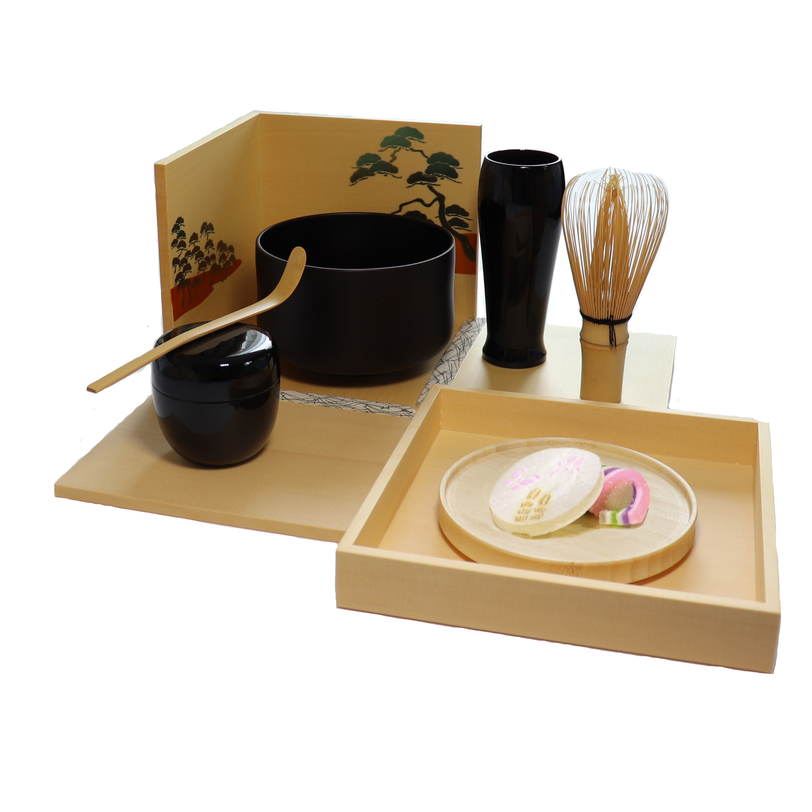 Tea-making set with black teapot, cups, and wooden tools on a white background