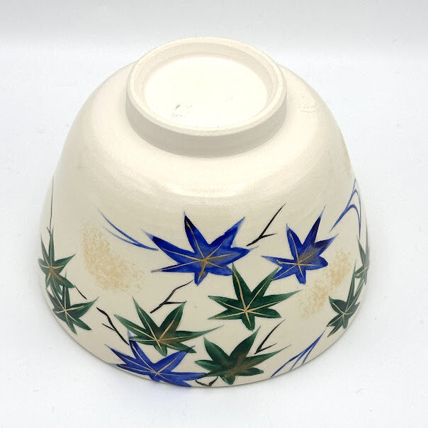 Top interior view of the Aomomiji matcha bowl showing green and blue maple leaves with flowing water around the inner rim