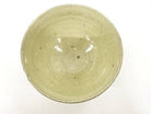 Top view of the Koijitsu matcha bowl showing its softly glazed interior, visible throwing rings, pale speckling, and natural firing variation.