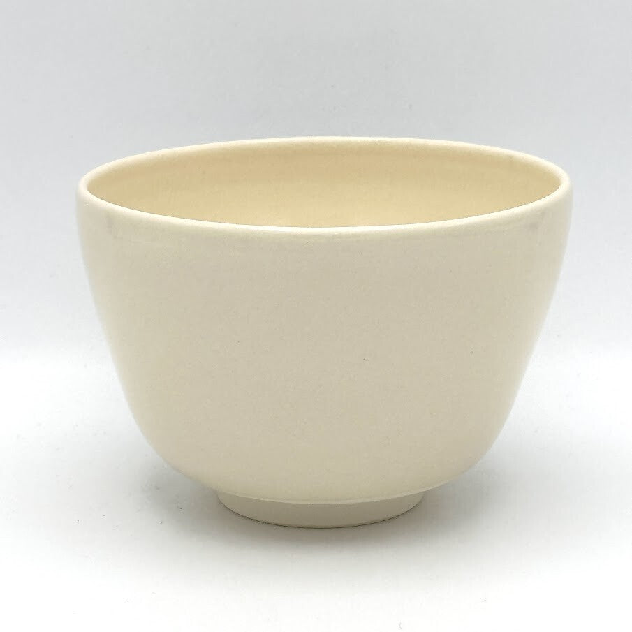 Reverse view of the Ayame Kyo Ware chawan showing its simple ivory glazed surface and rounded form