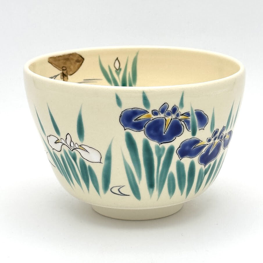 Hand-painted Kyo Ware matcha bowl featuring blue and white Ayame Japanese iris blossoms with slender green leaves