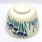 Underside view of the Ayame Kyo Ware matcha bowl showing its ceramic foot and hand-painted Japanese iris decoration