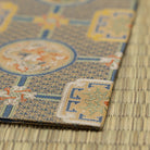 Angled view of a Japanese Nishijin silk kobukusa woven with traditional Shokko brocade for way of tea