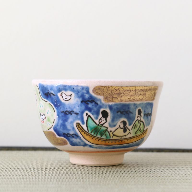 Handcrafted Kyo Ware matcha bowl with a boat scene beneath a deep blue starry sky and gold accents