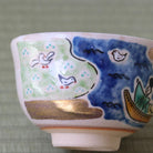 Reverse view of the Kyo Ware matcha bowl showing the blue night sky and surrounding hand-painted decorative motifs