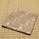 Angled view of the hand-sewn khaki green Chitose-bon kobukusa resting on tatami.