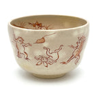 Hand-painted Kyo Ware matcha bowl featuring the traditional Choju-Giga frolicking animals motif in red-brown linework