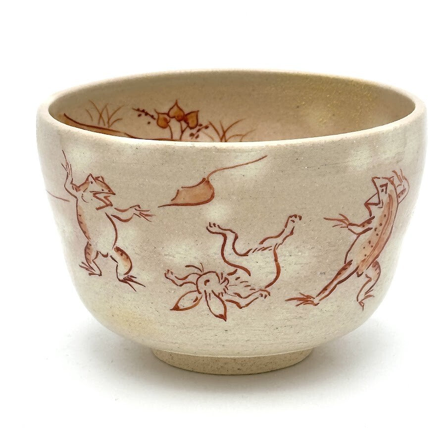 Hand-painted Kyo Ware matcha bowl featuring the traditional Choju-Giga frolicking animals motif in red-brown linework