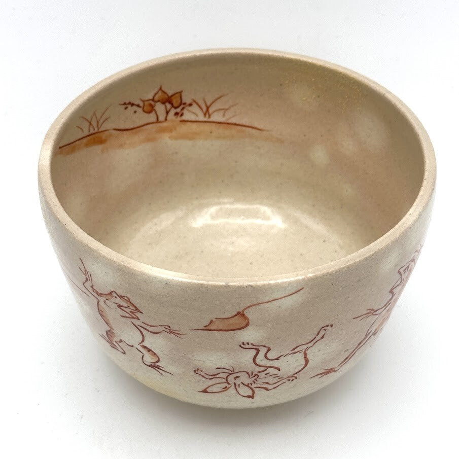 Top interior view of the Choju-Giga Kyo Ware matcha bowl showing hand-painted frolicking animal figures around the bowl