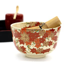 Ninsei-style autumn maple leaves matcha bowl arranged with traditional Japanese tea utensils