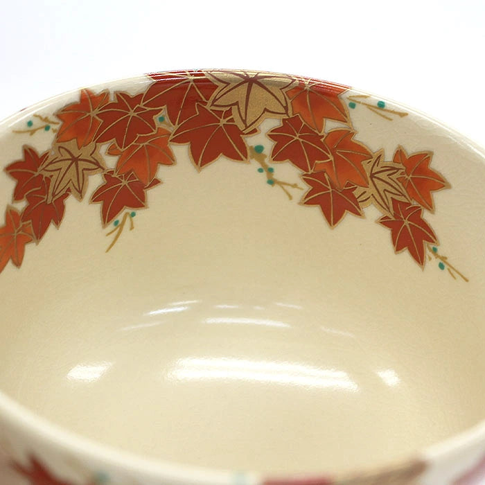 Interior detail of Eika Miyaji matcha bowl with autumn maple leaves decorating the inner rim