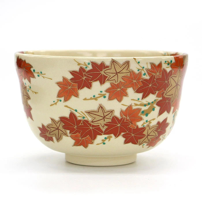 Side view of Eika Miyaji matcha bowl featuring red and gold autumn maple leaves