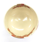 Top view inside the Ninsei-style matcha bowl with autumn maple leaf decoration around the rim