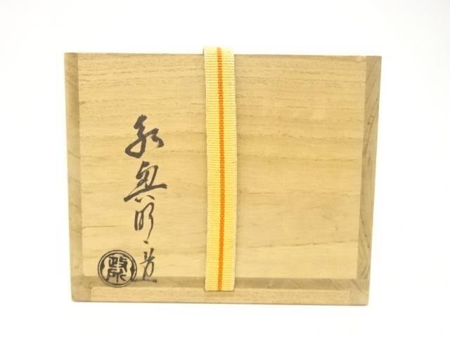 Exterior of the original wooden storage box with Japanese calligraphy, a circular seal, and a yellow securing cord.