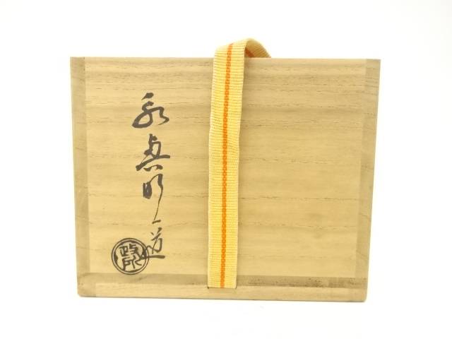 Exterior of the wooden storage box with Japanese calligraphy, a circular seal, and a yellow securing cord for the Eiko Meido Raku matcha bowl.