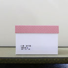 Pink and white presentation box for the Eishin Kato Nami Chidori Ninsei-style Kyo-yaki matcha bowl