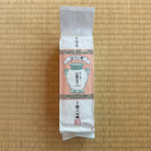 Tea package with a traditional design on a wooden surface