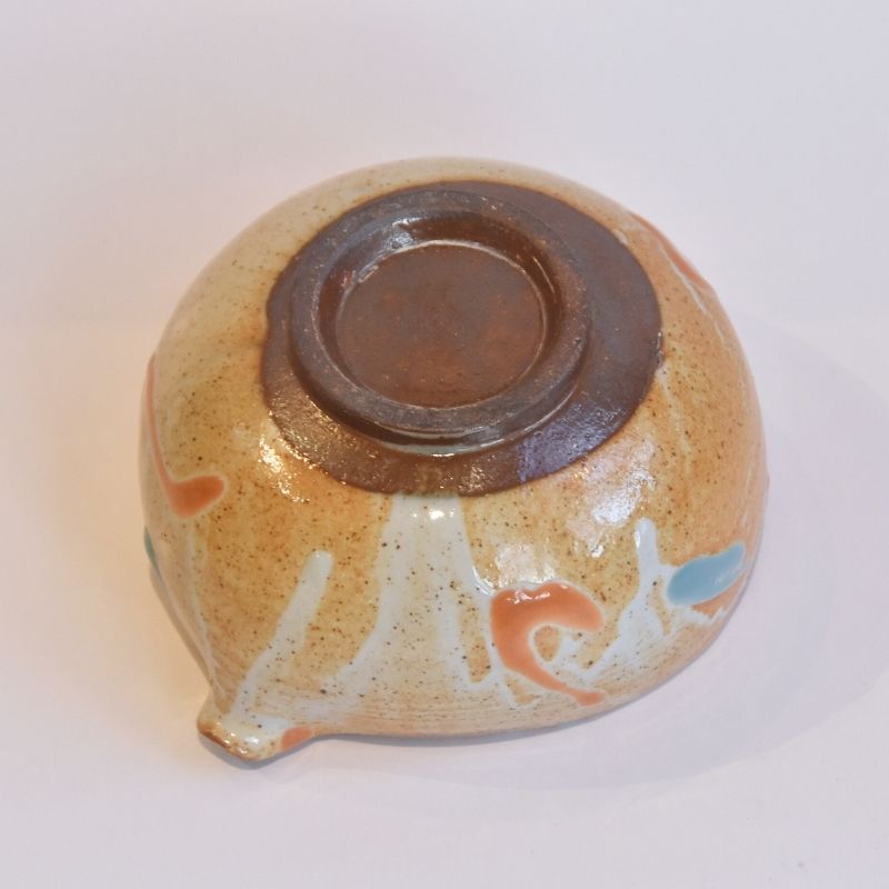 Ceramic bowl with brown interior and beige exterior on a white background