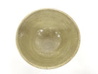 Top view of the Izumino Ware matcha bowl showing its softly glazed olive-beige interior with natural speckling and firing variation.