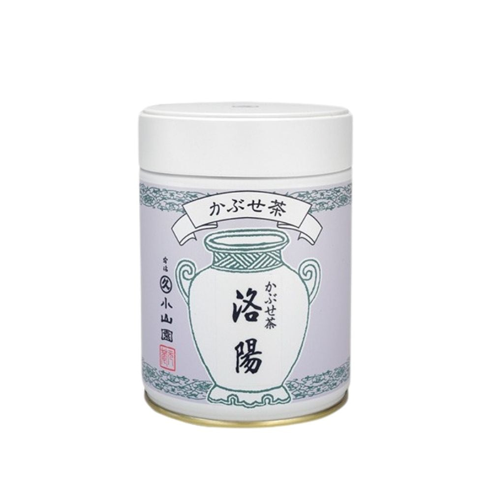 White tea canister with decorative design and text on a white background