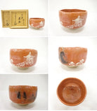 Multiple views of the pre-owned Aka Raku matcha bowl showing the white pavilion landscape, smoky black kiln marks, red interior, and underside.