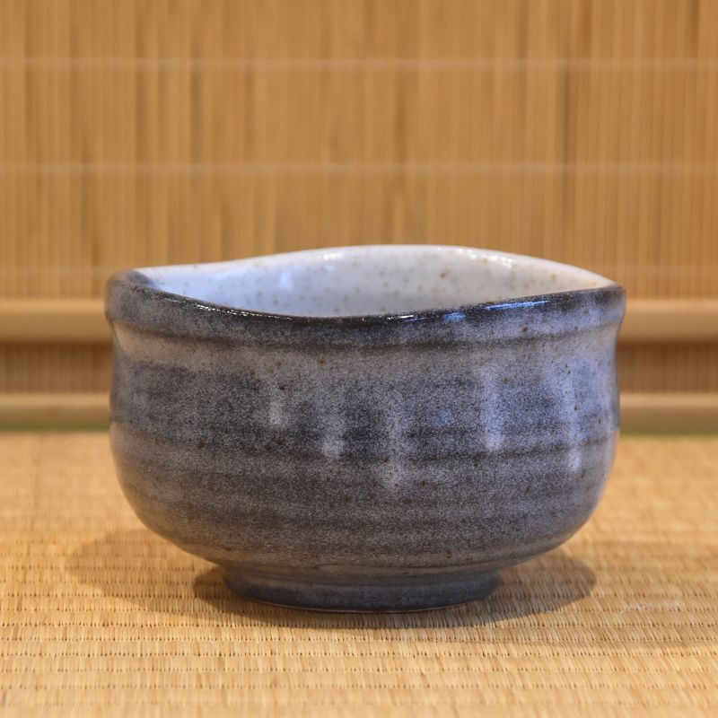 Back view of the Kutani Ware matcha bowl highlighting its softly mottled blue-gray glaze, rounded form, and gently irregular rim.
