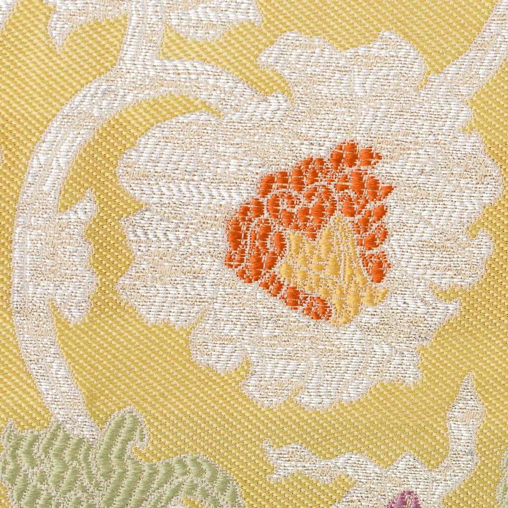Close-up of a silver brocade peony motif woven into Kyoto Nishijin silk
