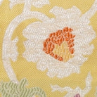 Close-up of a silver brocade peony motif woven into Kyoto Nishijin silk