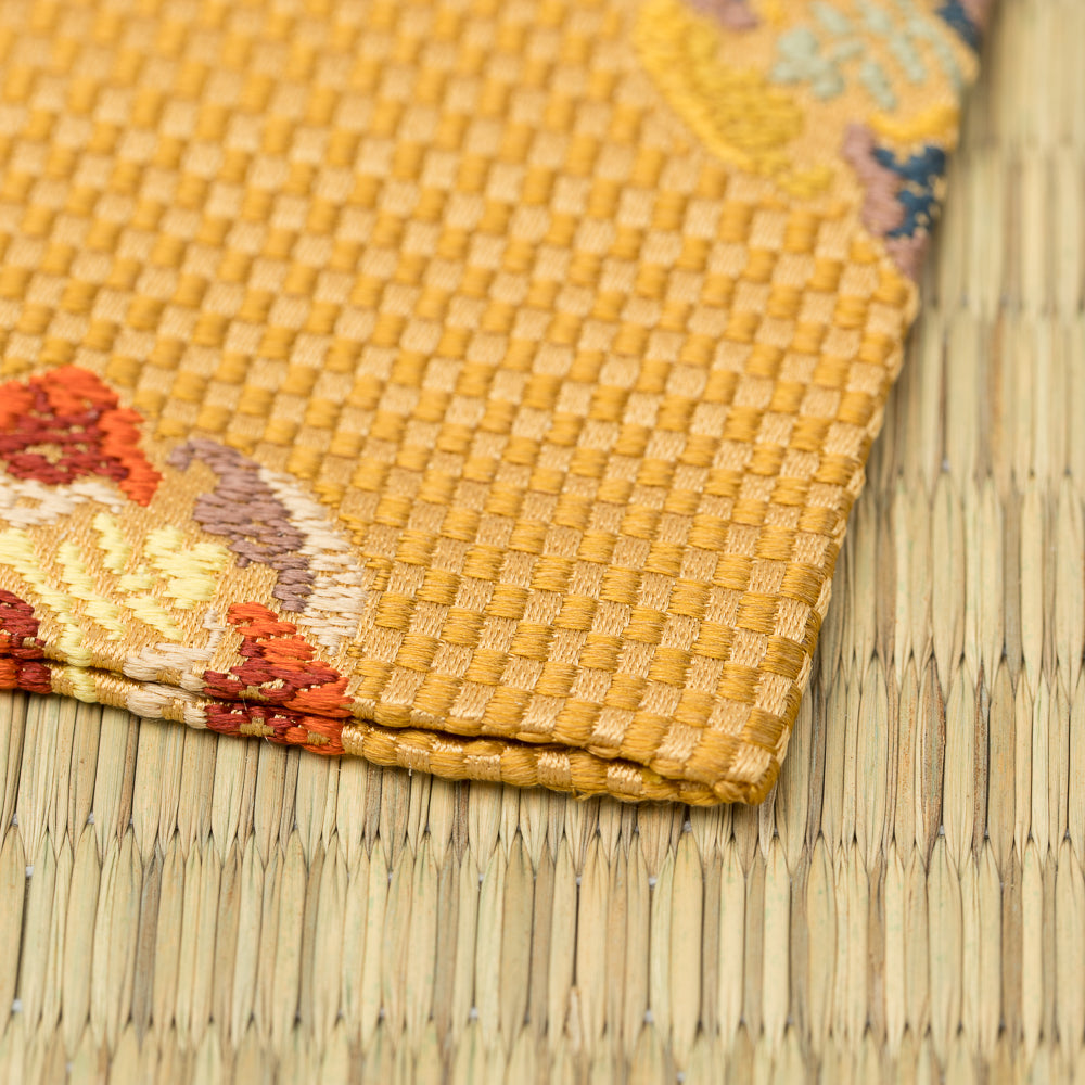 Angled view of a Japanese Nishijin silk kobukusa handcrafted for the tea ceremony