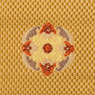 Close-up of an intricate floral motif woven into Kyoto Nishijin silk brocade