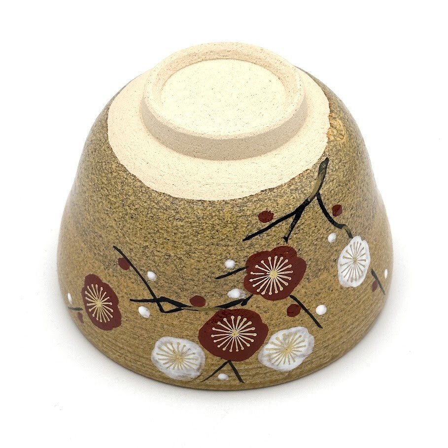 Underside view of the Kiyomizu-yaki Eda-Ume matcha bowl showing its ceramic foot and hand-painted white and red plum blossom decoration