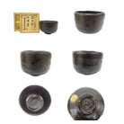 Set of black ceramic tea cups with a wooden box on a white background