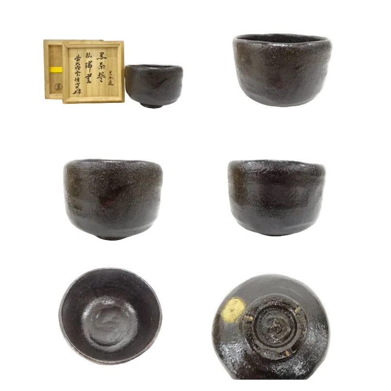 Set of black ceramic tea cups with a wooden box on a white background