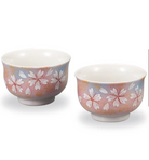 Two ceramic bowls with floral patterns on a white background