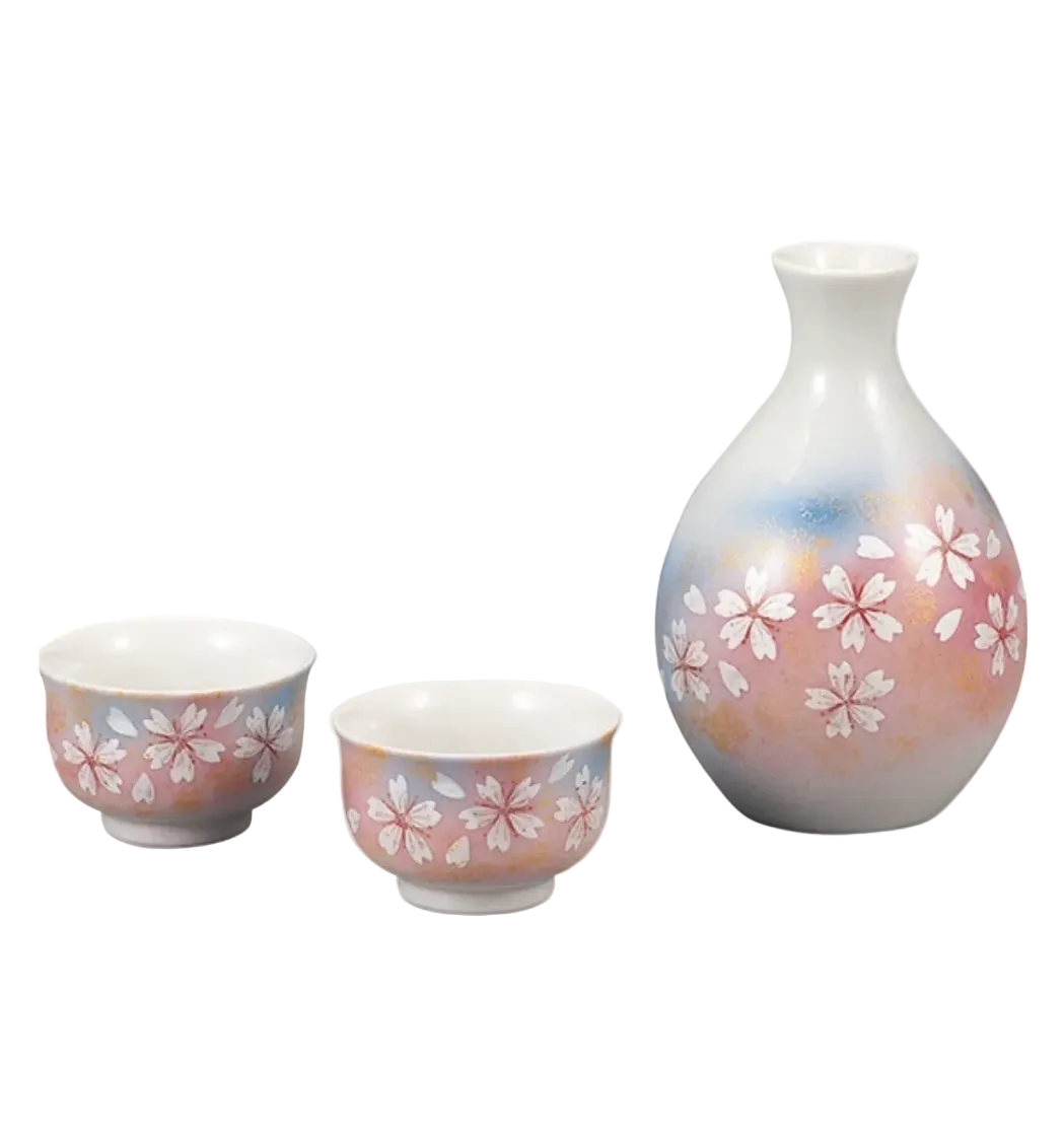 Ceramic set with two cups and a vase featuring floral patterns on a white background