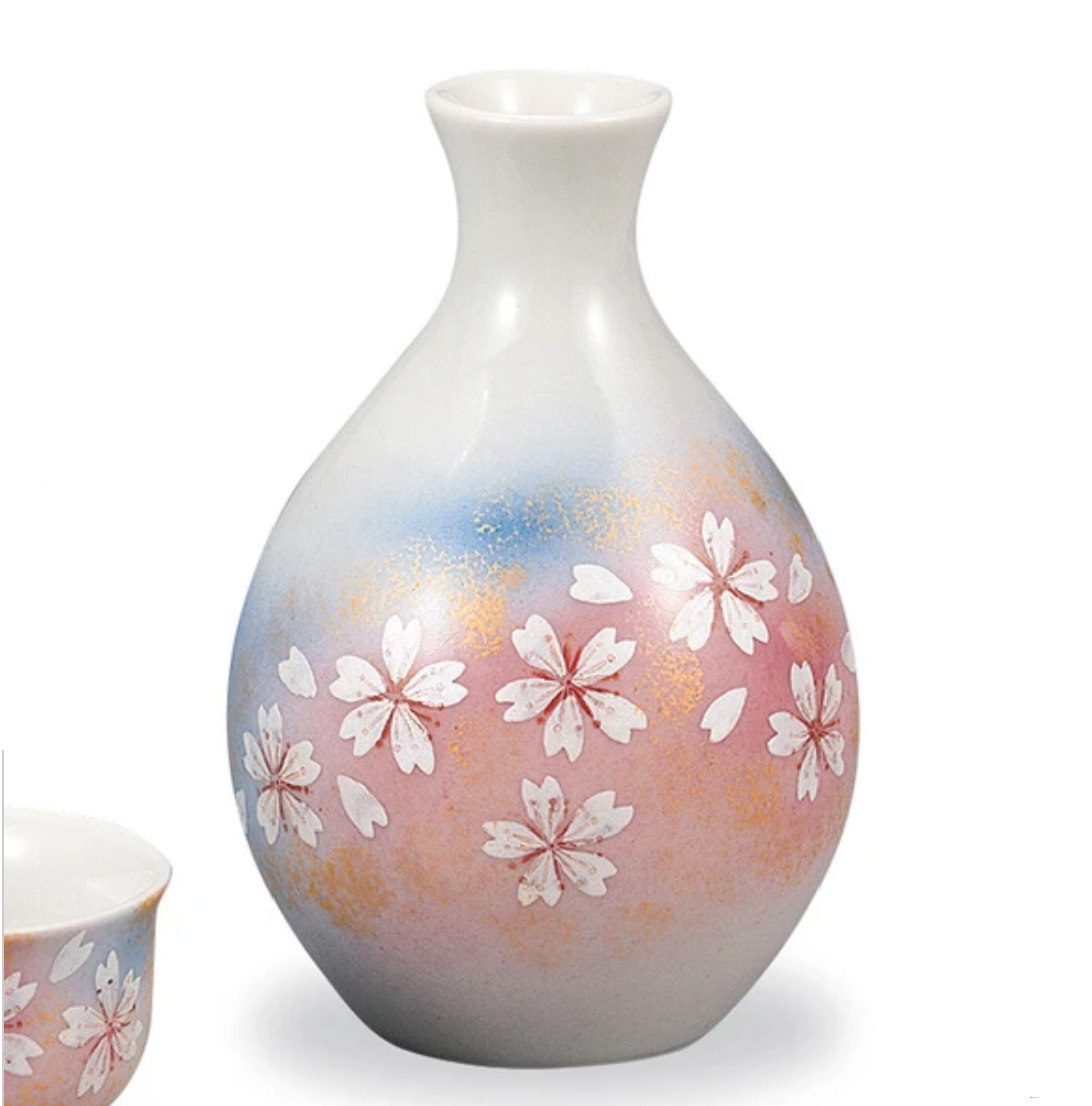 Ceramic vase with floral design on a white background