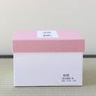 Pink and white presentation box for the Kyo-yaki Akikusa and full moon matcha bowl